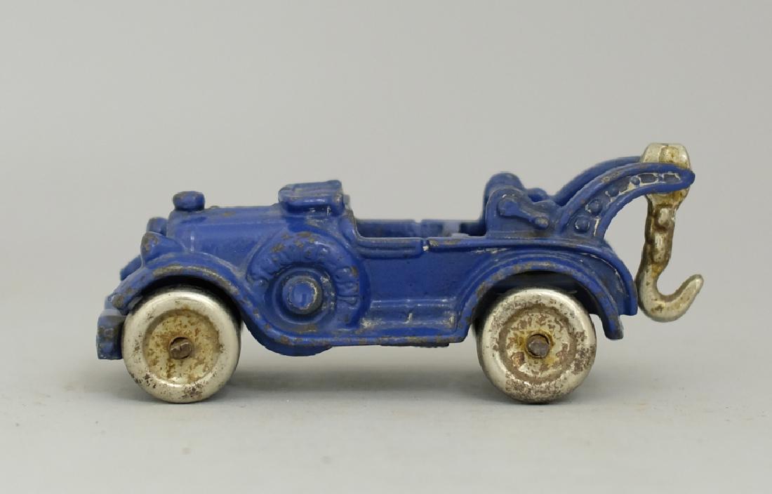 Tow Truck Cast Iron Toy: Made by Hubley circa 1920's. Made of Cast Iron. 5.5" Long. Excellent Condition.