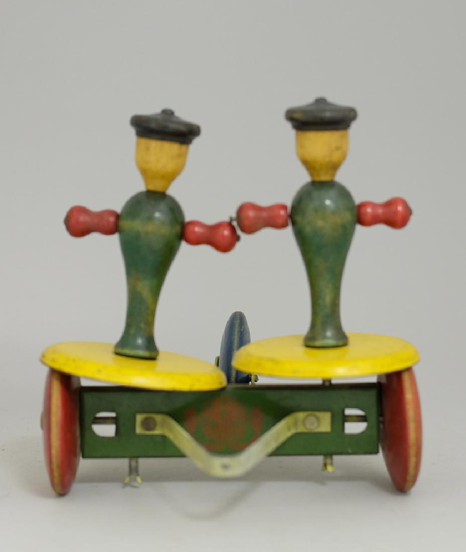 Toy Tinkers Whirly Tinker: Made of Iron and Wood. 7.5" Tall. Fine Condition.