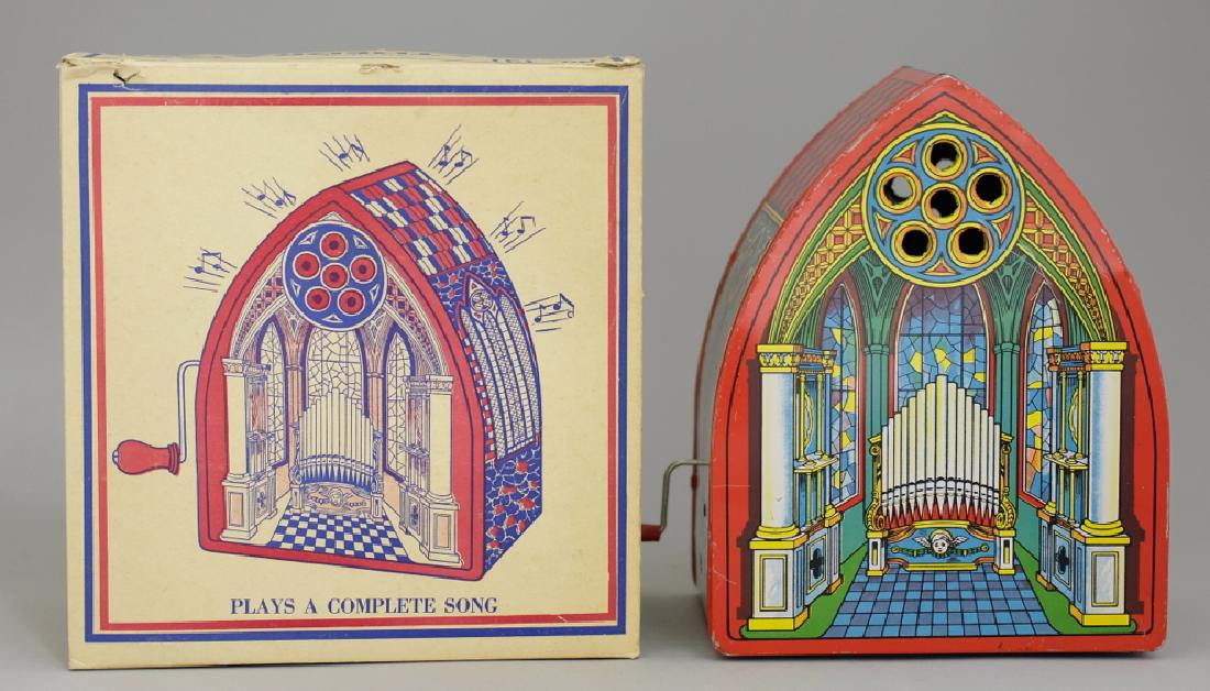 J. Chein Musical Cathedral in Original Box: Made by J. Chein circa 1930's. Hand crank the lever and music is played. Made of Tin. 9.25" Tall. Pristine Condition in Original Box.