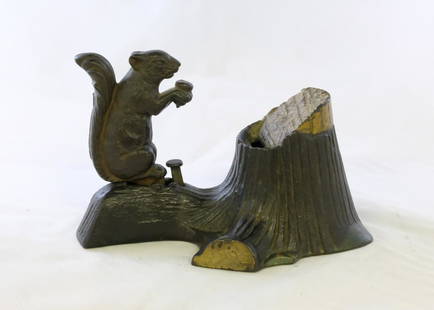 Squirrel at Tree Stump Mechanical Bank: Made by Mechanical Novelty Works. Made of Cast Iron. Very Fine Condition (Screw to hold base plate (underneath) replaced with rivet)