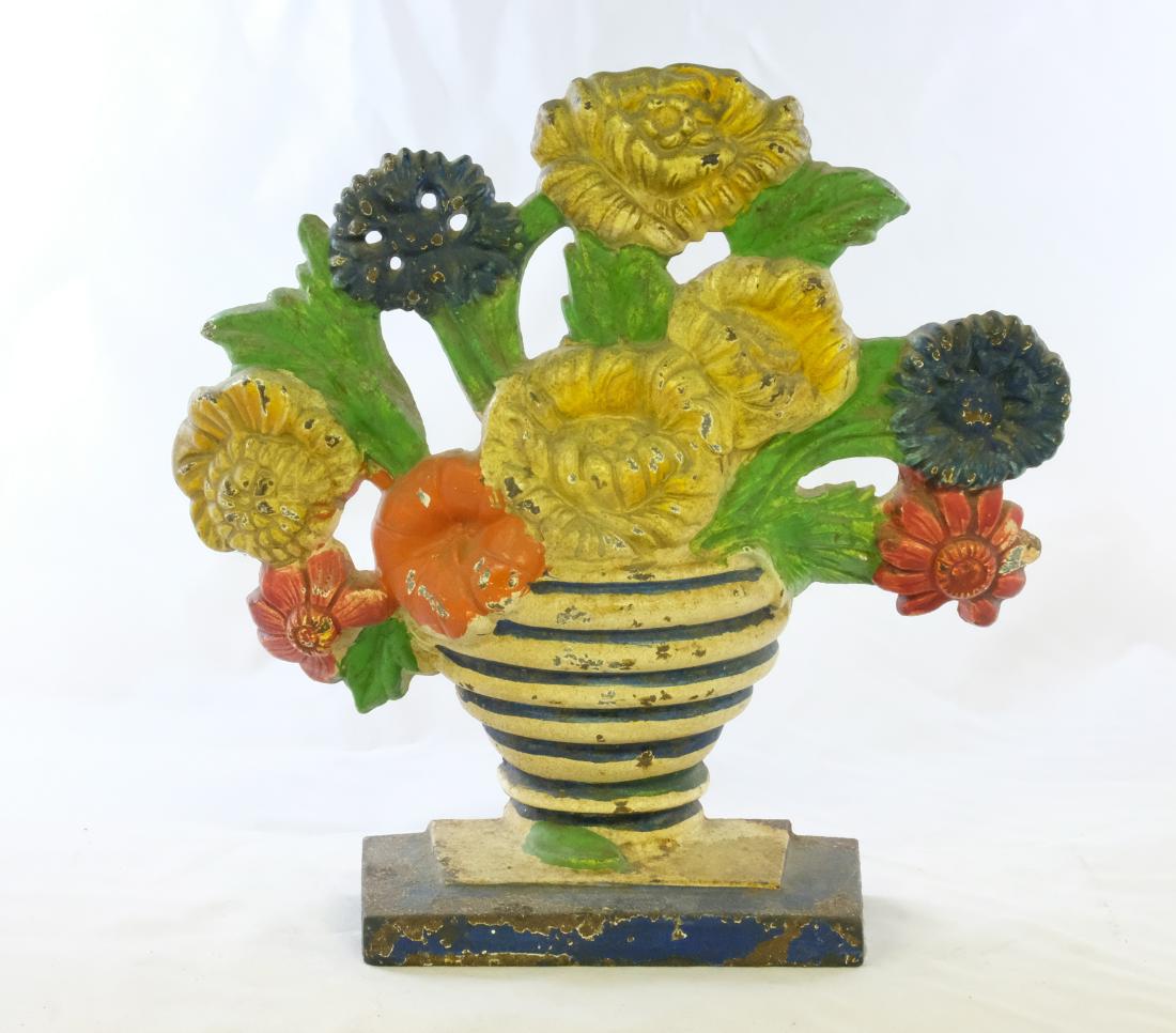 Marigolds Doorstop: Made by Hubley. 7 1/2" Tall. Made of Cast Iron. Very Good Condition.