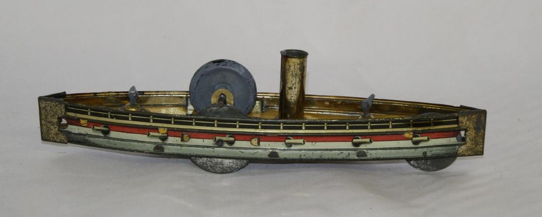 Hess Gun Ship: Made by Hess. 9 1/2" Long. Made of Tin. Works well. Very Fine Condition.