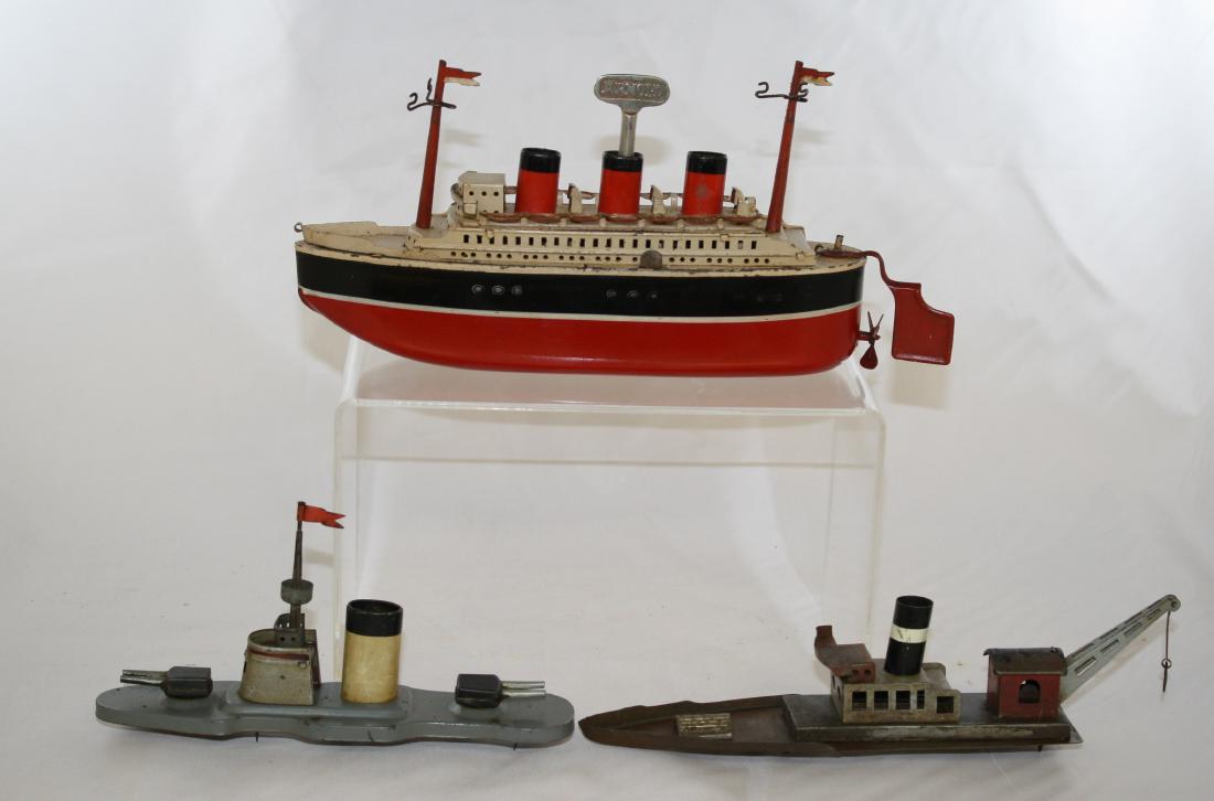 Multi Function Boat: Made by Arnold. Made of Tin. 9" Long. Works well. Excellent Condition (Top of Three Funnel Liner and Gun Boat Restored).
