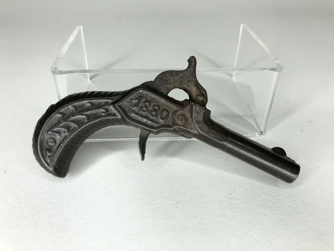 1880 Double Barrel Cap Gun: American. Circa 1880. 4 1/4 inches in length. Condition Excellent.