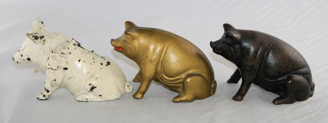 Three Seated Pig Cast Iron Still Banks (1 of 2)