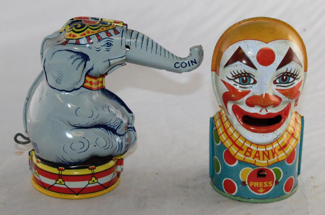 Chein Elephant & Clown Tin Banks: Both made by Chein. Elephant: Pull the lever and your coin will run down his trunk, depositing your coin. Clown: Place your coin on his tongue. Press the lever and he will gobble up your coin. Made of