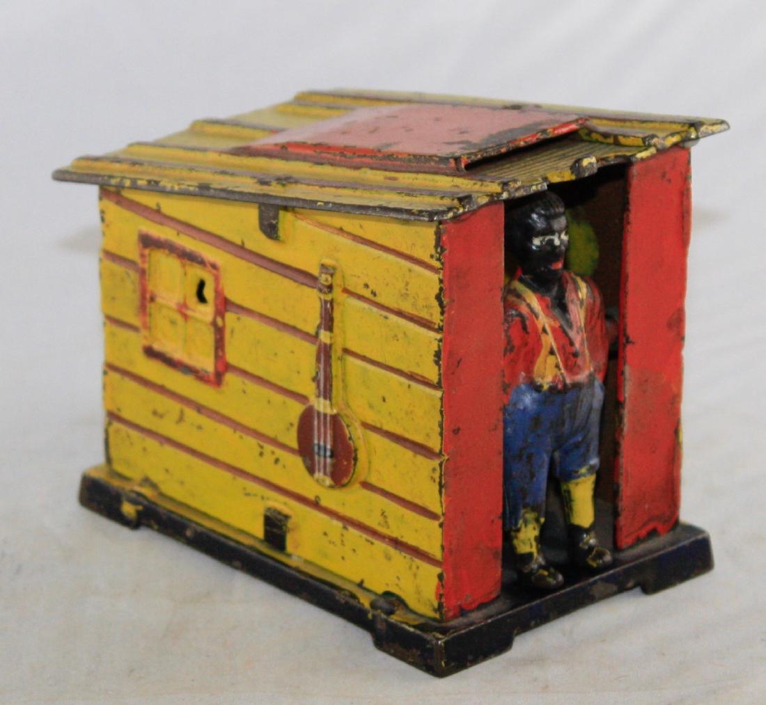Yellow Cabin Cast Iron Mechanical Bank (1 of 3)