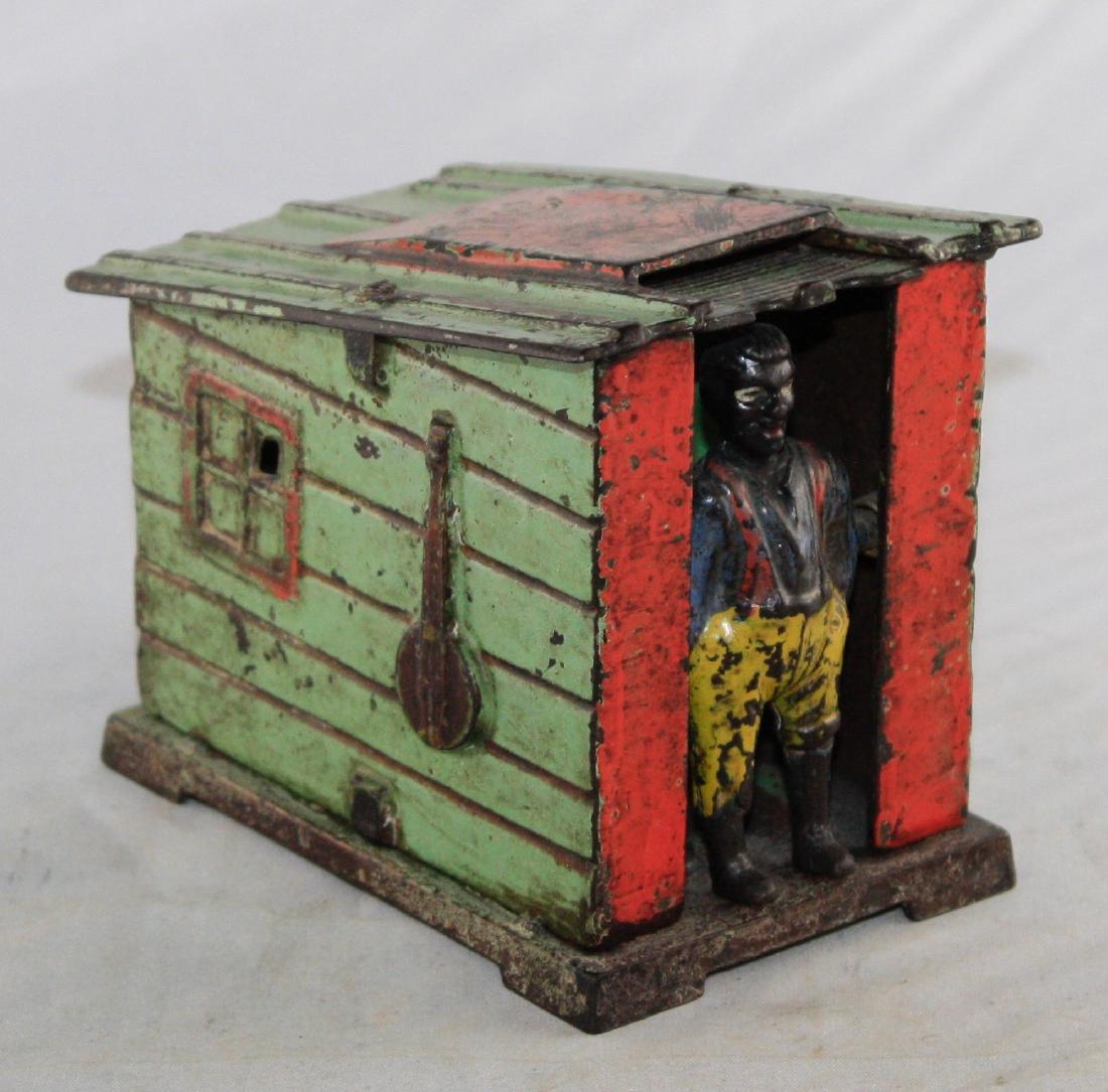 Green Cabin Cast Iron Mechanical Bank (1 of 3)