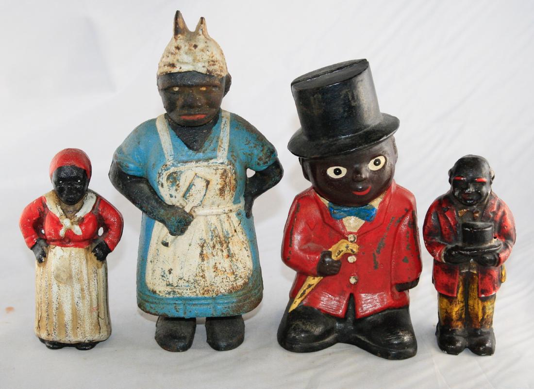 Four Black Themed Cast Iron Still Banks: These are modern banks. 4.75" - 8" T. All made of Cast Iron. Fine to Very Fine Condition.