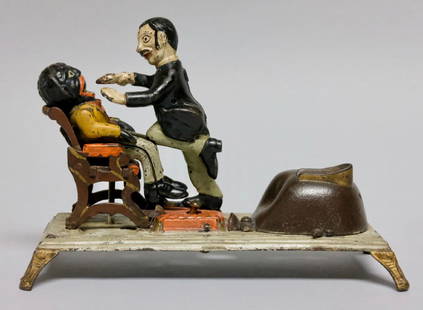 Cast Iron Dentist Mechanical Bank: Made by J. & E. Stevens Company circa 1880's of Cromwell, Connecticut. This is a scarce Mechanical Bank. Press the lever and the dentist falls back as he extracts the tooth from his patient. Made of C