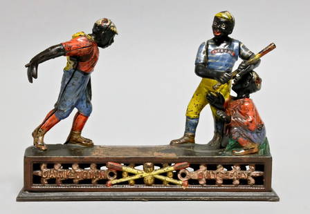 Cast Iron Darktown Battery Mechanical Bank: Made by J. & E. Stevens circa 1880's of Cromwell, Connecticut. Place a coin in the pitcher’s hand and press the lever. He pitches the coin and the batter swings, but the coin sails so quickly by him