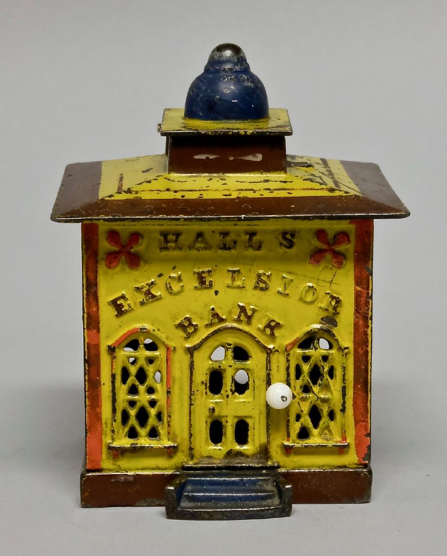 Yellow Cast Iron Hall's Excelsior Mechanical Bank (1 of 4)