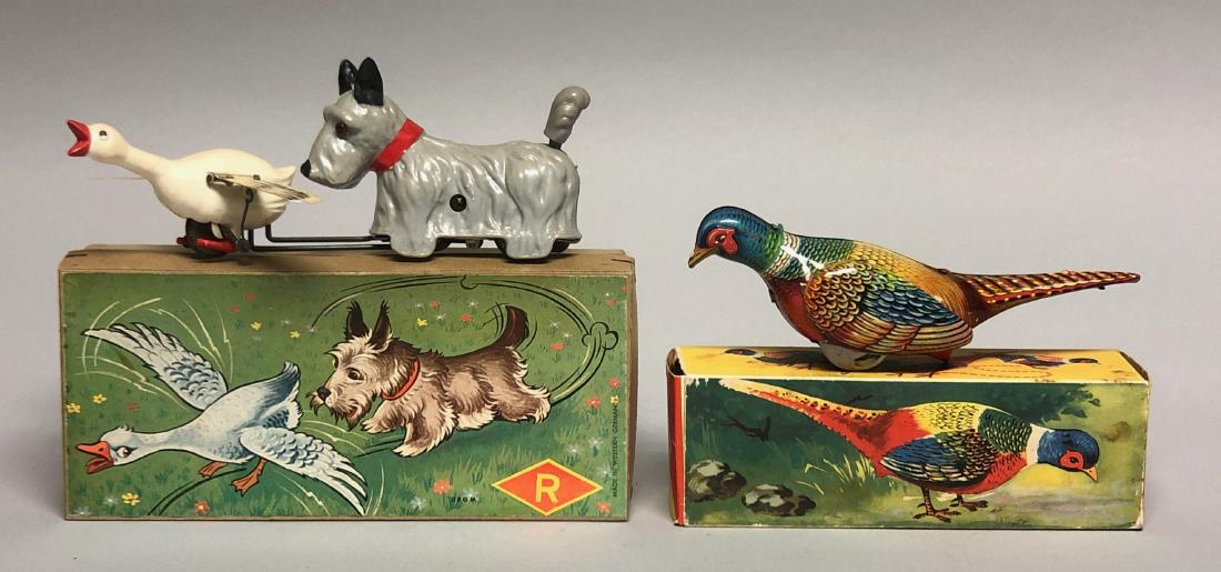 Windup Dog Chasing Goose and Eating Bird (1 of 2)