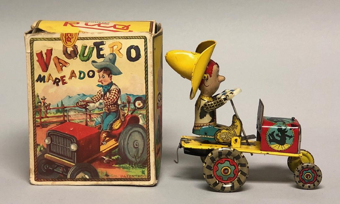 Tin Wind Up Vaquero Mareado: Made in Spain. Made of Tin. Works well. 4.5" L. Pristine Condition with Original Box.