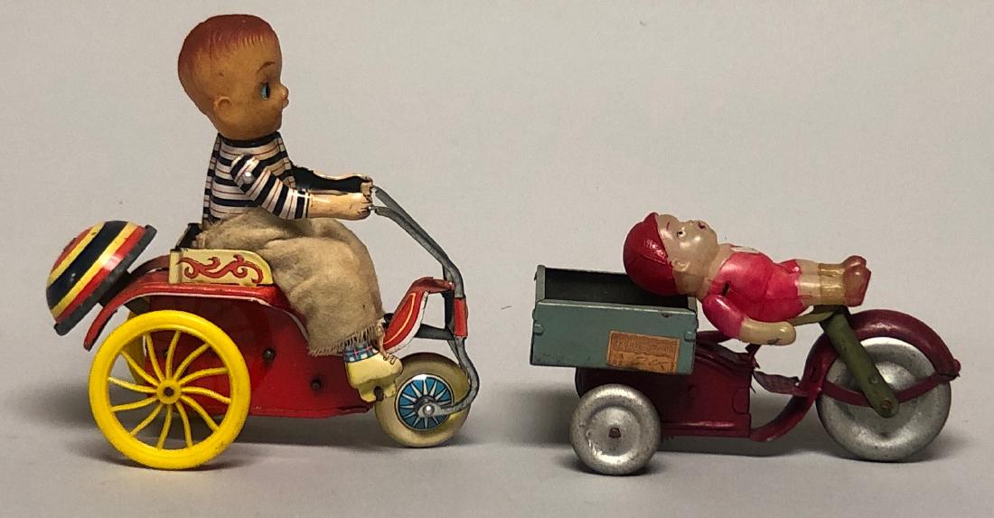 Two Tin and Celluloid Windup Boy Riding Scooters (1 of 2)