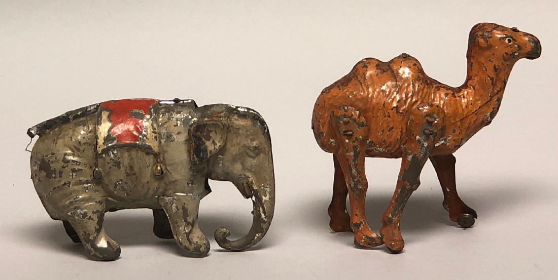 Tin Windup Hand Painted Elephant and Camel: Made in Germany. The Camel is 5.5" T. The Elephant is 6" L. Made of Tin. Both work well. Very Good to Fine Condition.