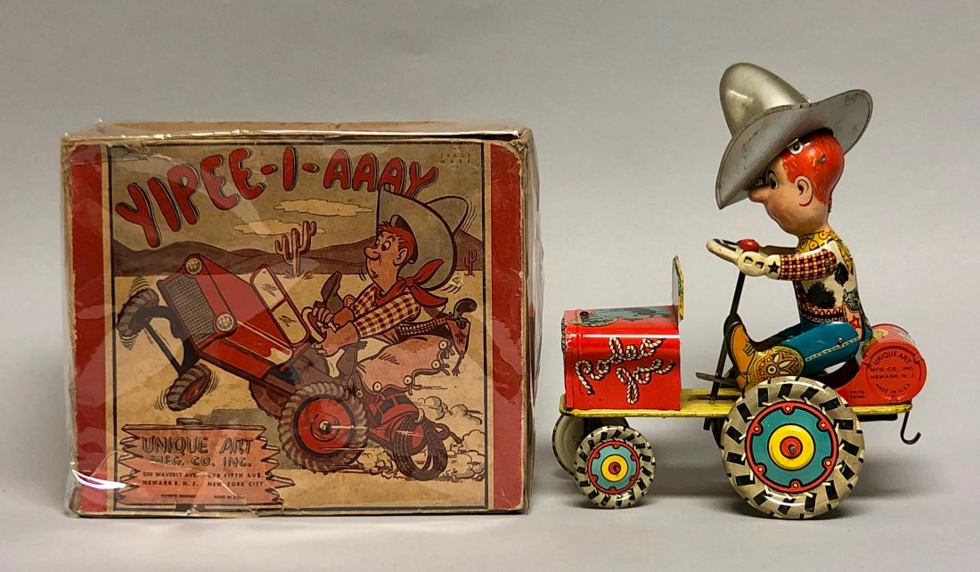 Windup Tin Unique Art Rodeo Joe: Made by Unique Art. Made of Tin. Action: The car drives around randomly as Rodeo Joe "bucks" forwards and backwards. 7"L x 9" T. Works well. Pristine with Original Box.