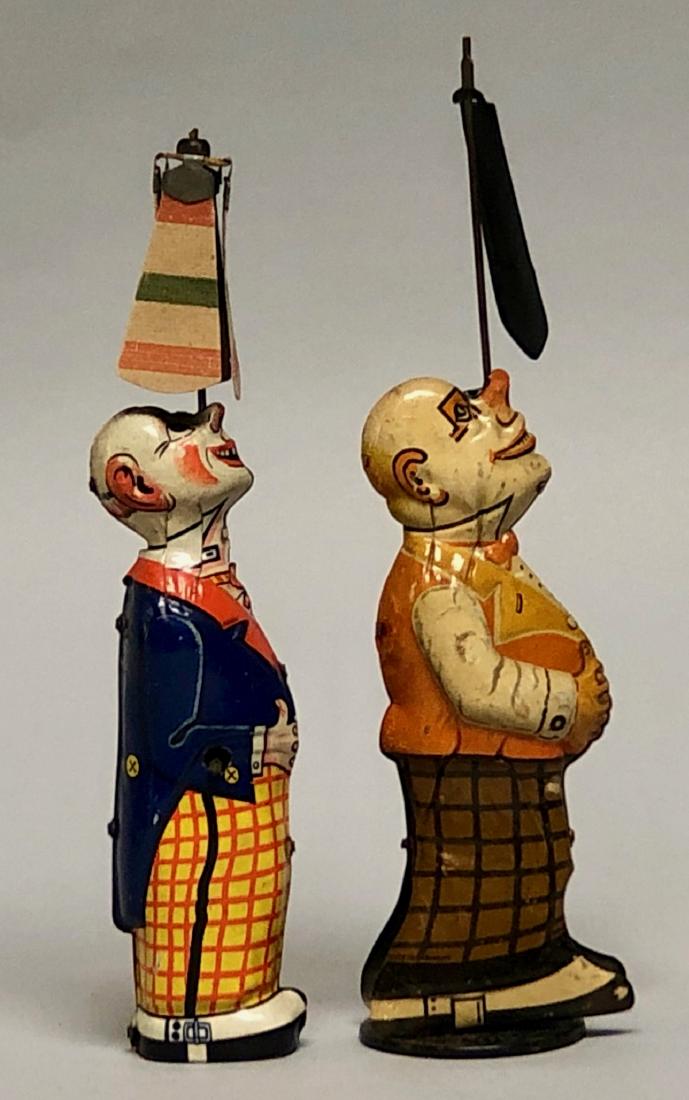 Two Tin Windup Clowns Spinning Fans (1 of 2)