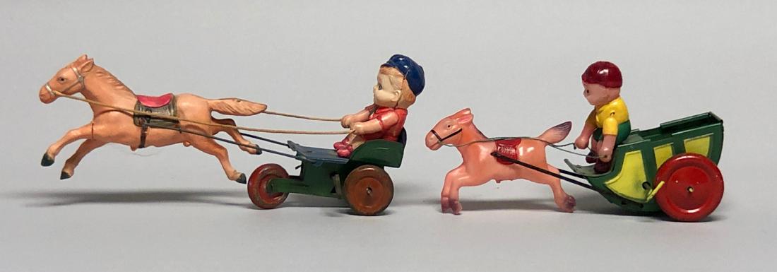 Two Celluloid Windup Horse and Drivers (1 of 2)