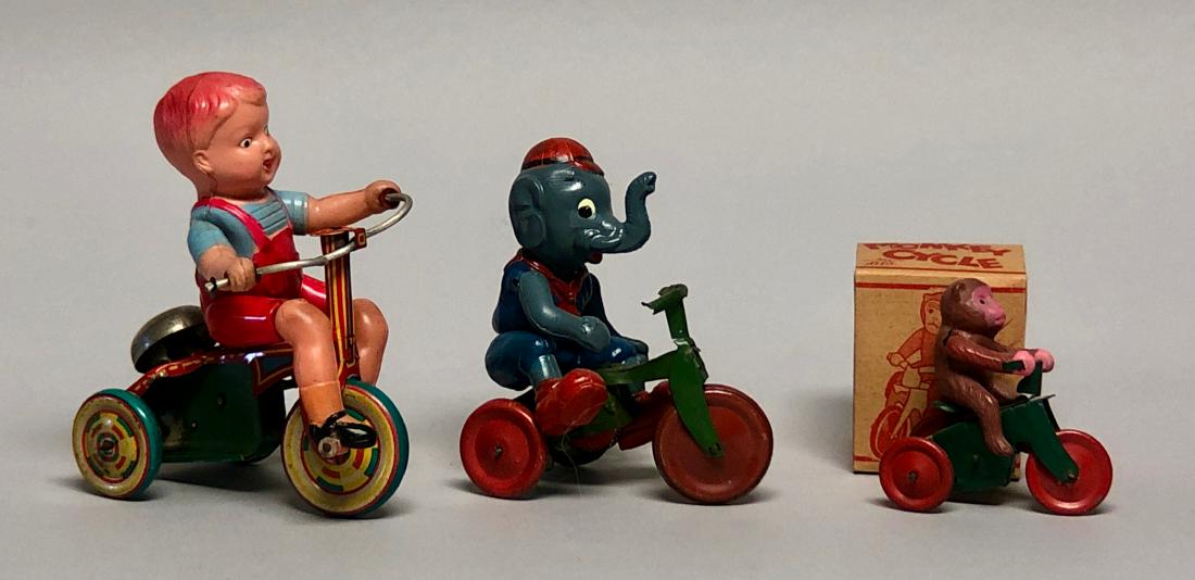 Three Windup Celluloid Tricycle Toys: Made in Japan. The Elephant Celluloid Figure is amazing. Made of Celluloid and Tin. All work well. 2.75" - 4.5" L. Excellent to Near Mint. Monkey Cycle with Original Box.