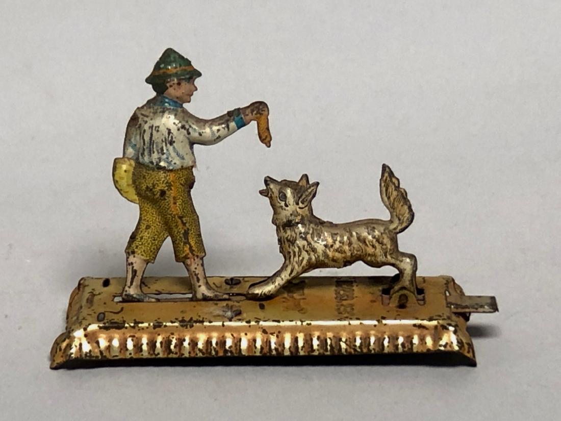 Penny Toy Boy Feeding Dog a Hot Dog (1 of 2)