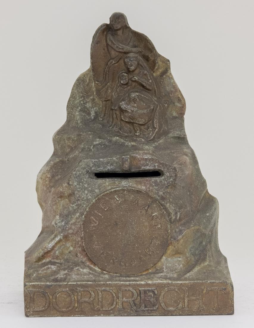 Dordrecht Cast Iron Still Bank: Made in Austria circa 1910's. This is a rare bank. 7" T. Made of Cast Iron. Very Fine Condition.