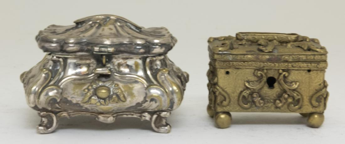 Two Ornate Chest Tin Still Banks (1 of 2)