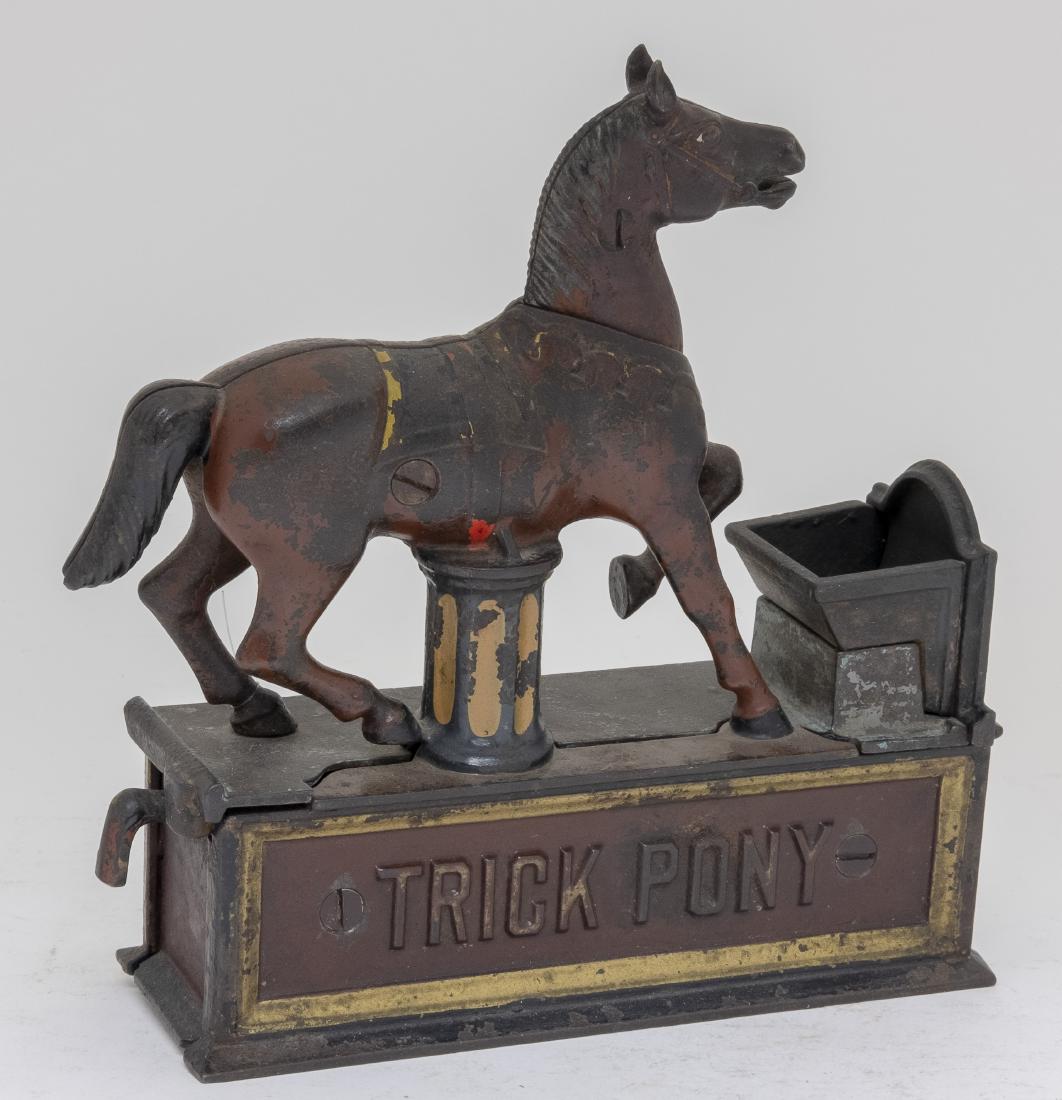 Trick Pony Cast Iron Mechanical Bank: Made by Shepard Hardware Company Buffalo, New York - Circa 1888 Place a coin in the pony's mouth and pull the lever. The pony deposits the coin into the trough. Made of Cast Iron. Good Condition. 1" c