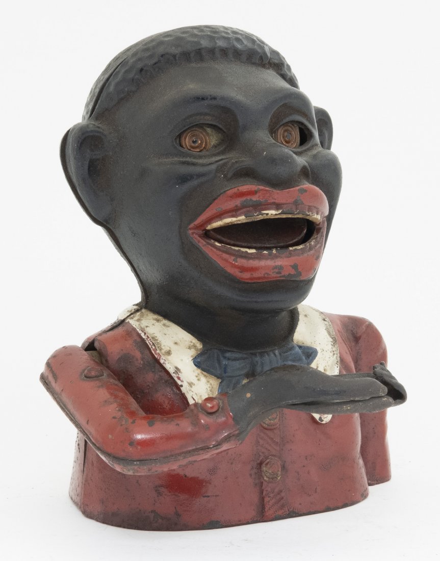 Jolly N. Butterfly Tie Iron Mechanical Bank: Made by Sydenham & McOustra of England - Circa 1930's. Made of Cast Iron. Professionally Restored.