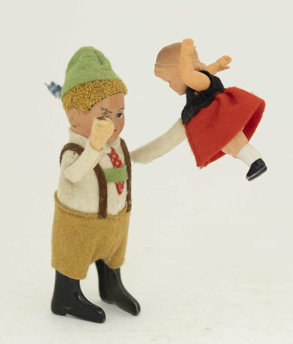 Schuco Man Lifting Girl Windup Toy (1 of 4)