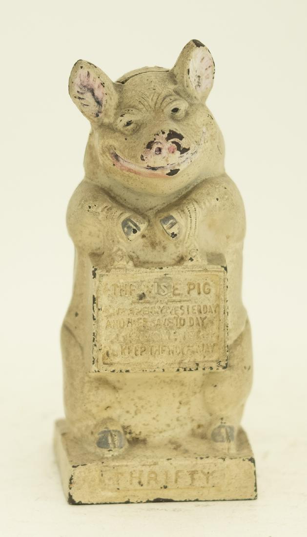 Hubley Thrifty Pig Cast Iron Still Bank: Made by Hubley of Lancaster, Pennsylvania - Circa 1930's. Made of Cast Iron. 6 3/4" T. Fine Condition. Could use a clean.