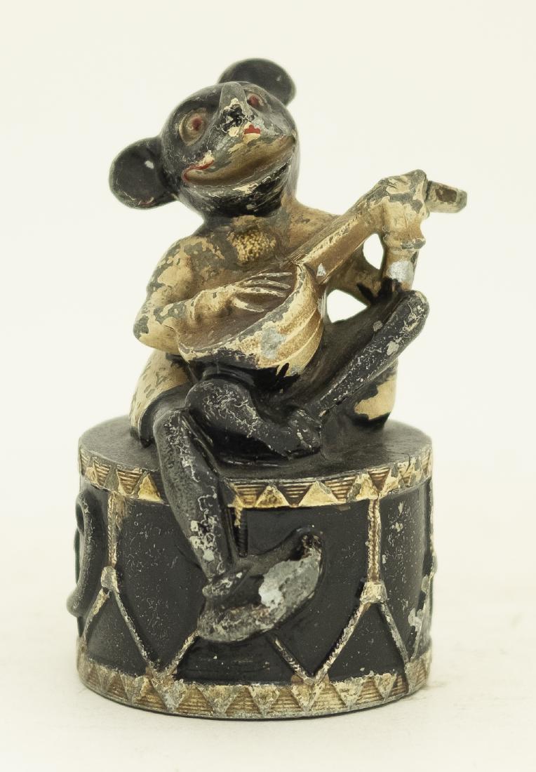 Lead Mickey Mouse on Drum Still Bank: Made by Arthur Shaw Company - Circa 1930. 4 5/8" T. Made of Lead. Good Condition.