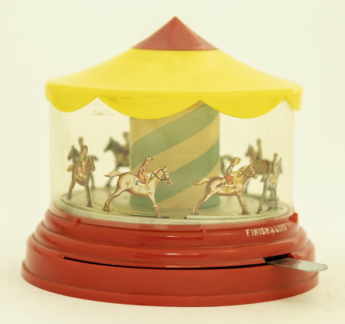 Plastic Merry Go Round Mechanical Bank (1 of 2)