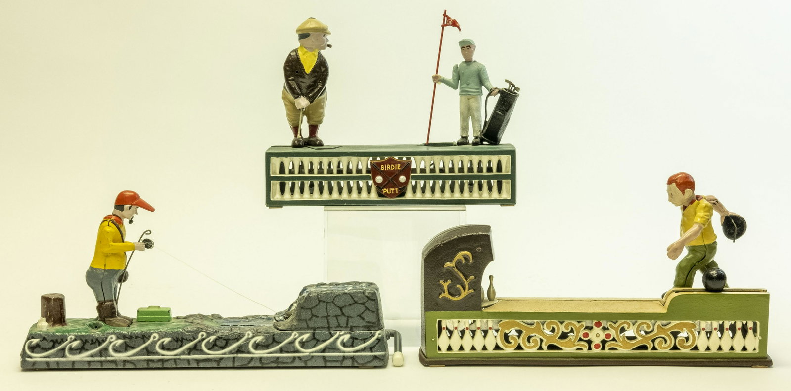 Three Sporting Iron Mechanical Banks: Includes: Fishing, Bowling and Golfing Mechanical Banks. Made of Cast Iron. Pristine Condition.