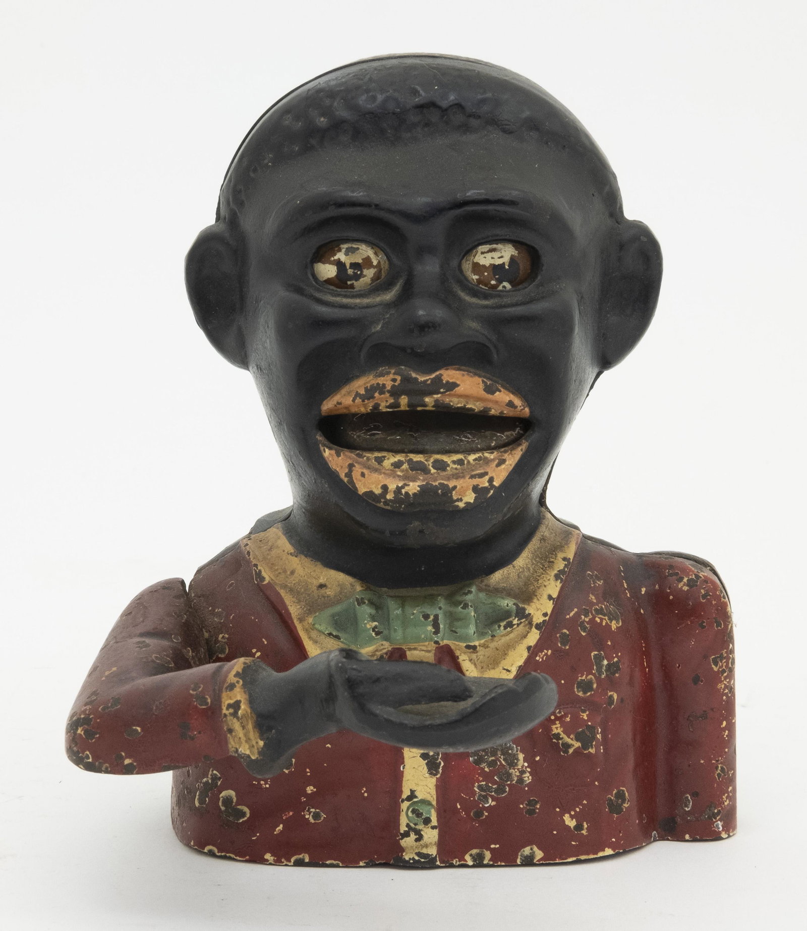 Little Joe with Dagger Eyes Mechanical Bank: Made by John Harper & Co. Ltd. Willenhall, England - Circa 1930’s. Made of Cast Iron. Fine Condition.