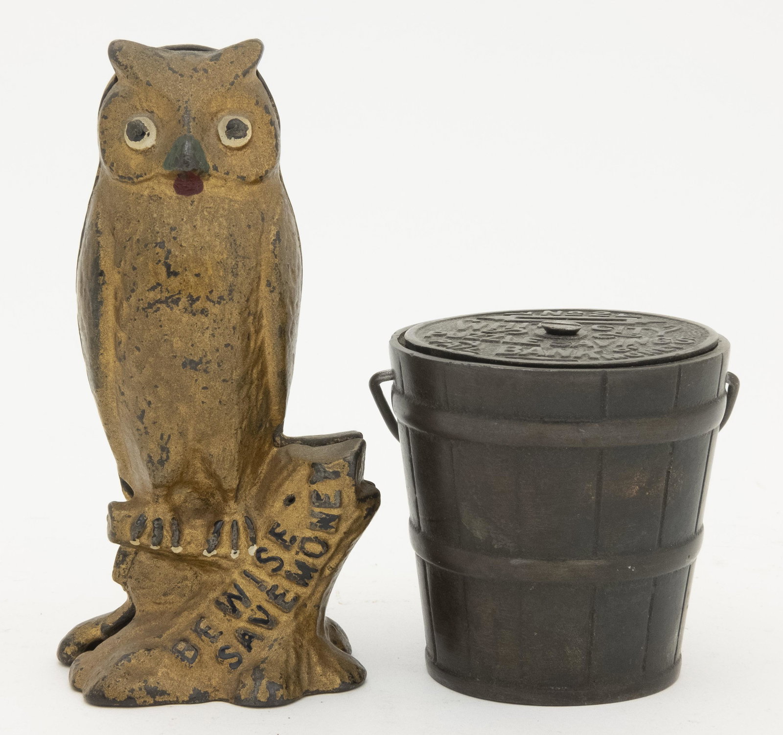 Be Wise Owl & White City Pail Iron Banks: Included: Be Wise Owl by A. C. Williams circa 1920's and White City Puzzle Pail No. 2 by Nicol & Co of Chicago circa 1890's. Made of Cast Iron. Fine to Very Fine Condition. White City Puzzle Handle Re