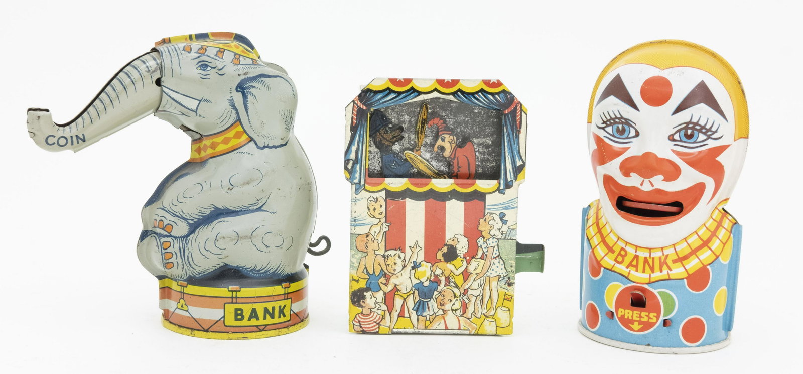 Three Tin Mechanical Banks: Included: Elephant Raises Trunk by J. Chein, Clown by J. Chein and Punch and Judy English. Made of Tin. Very Fine to Excellent Condition.
