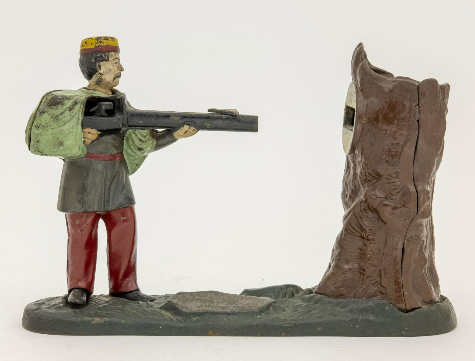 Creedmoor Cast Iron Mechanical Bank: Made by J. & E. Stevens Company. Cromwell, Connecticut - Circa 1877. This is a classic coin-shooting bank. Made of Cast Iron. Fine Condition. The body is an old repaint.