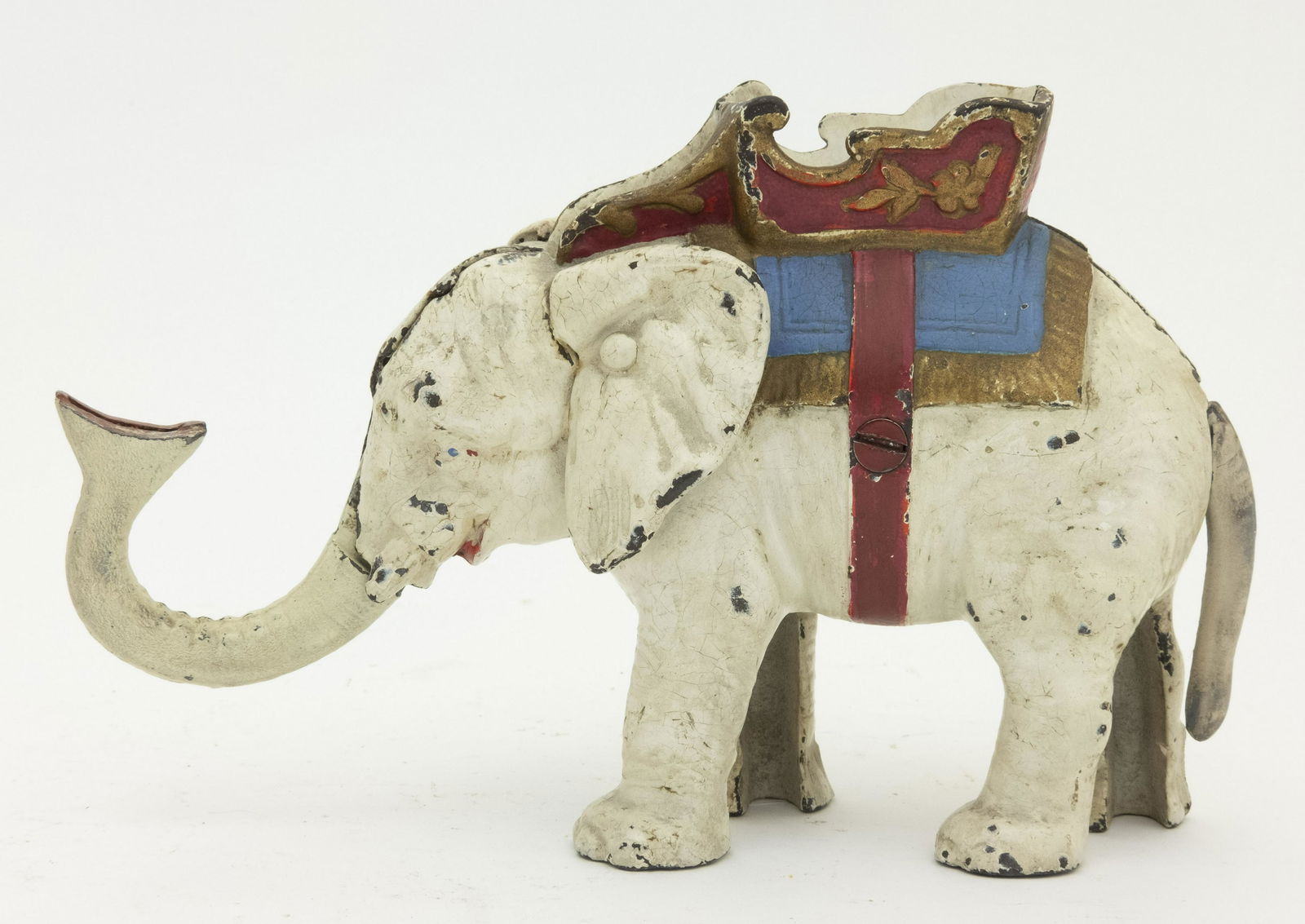 Hubley Elephant Pull Tail Iron Bank: Hubley of Lancaster, Pennsylvania - Circa 1935. Place a coin in the trunk, pull the tail and it is deposited into the howdah. Made of Cast Iron. Trunk and Tail Repainted.