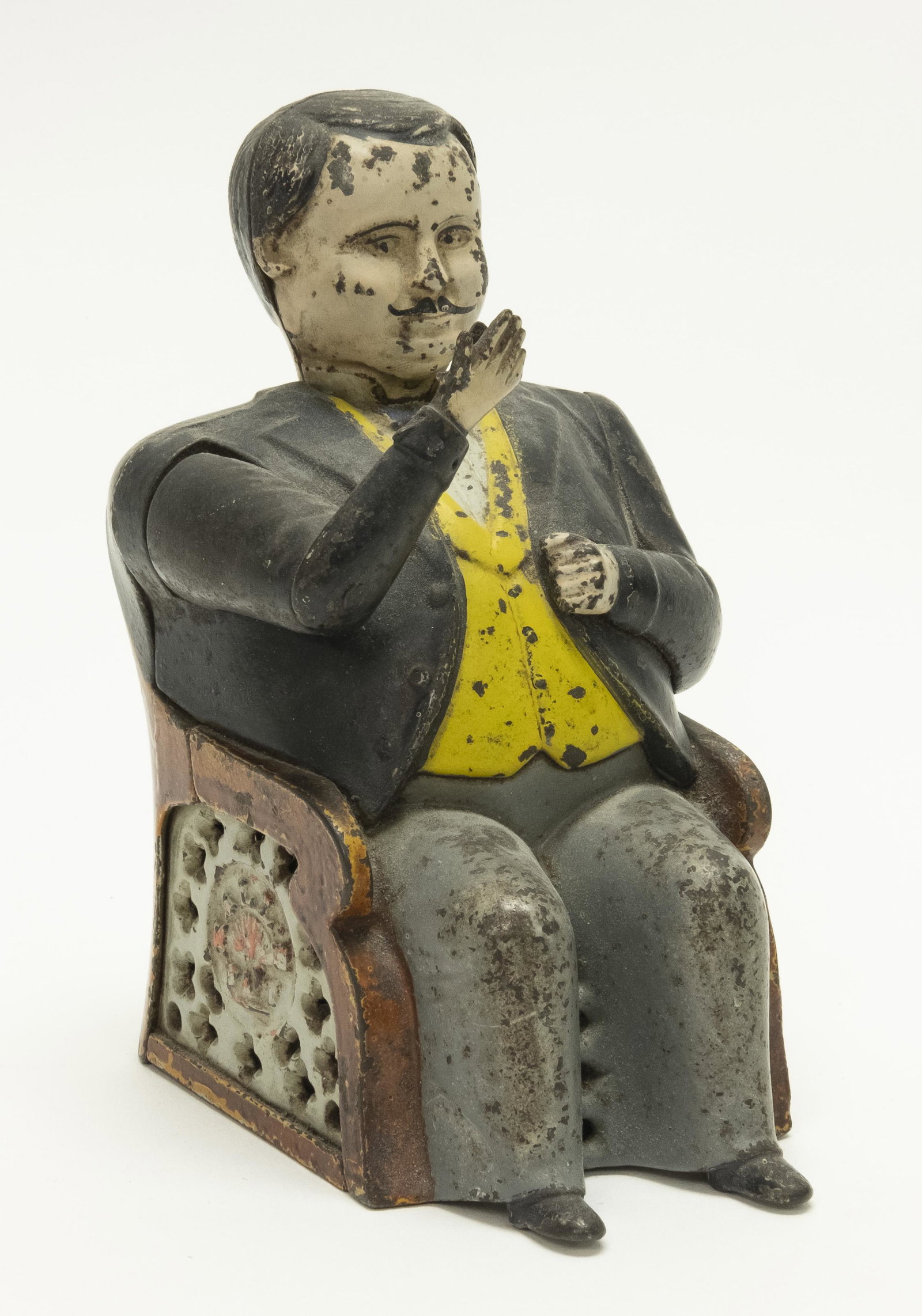Tammany Cast Iron Mechanical Bank: Made by J. & E. Stevens of Connecticut circa 1880's. Place a coin in his hand and its weight causes the hand to lower and deposit the coin into his pocket. His nod signifies that he has accepted your 