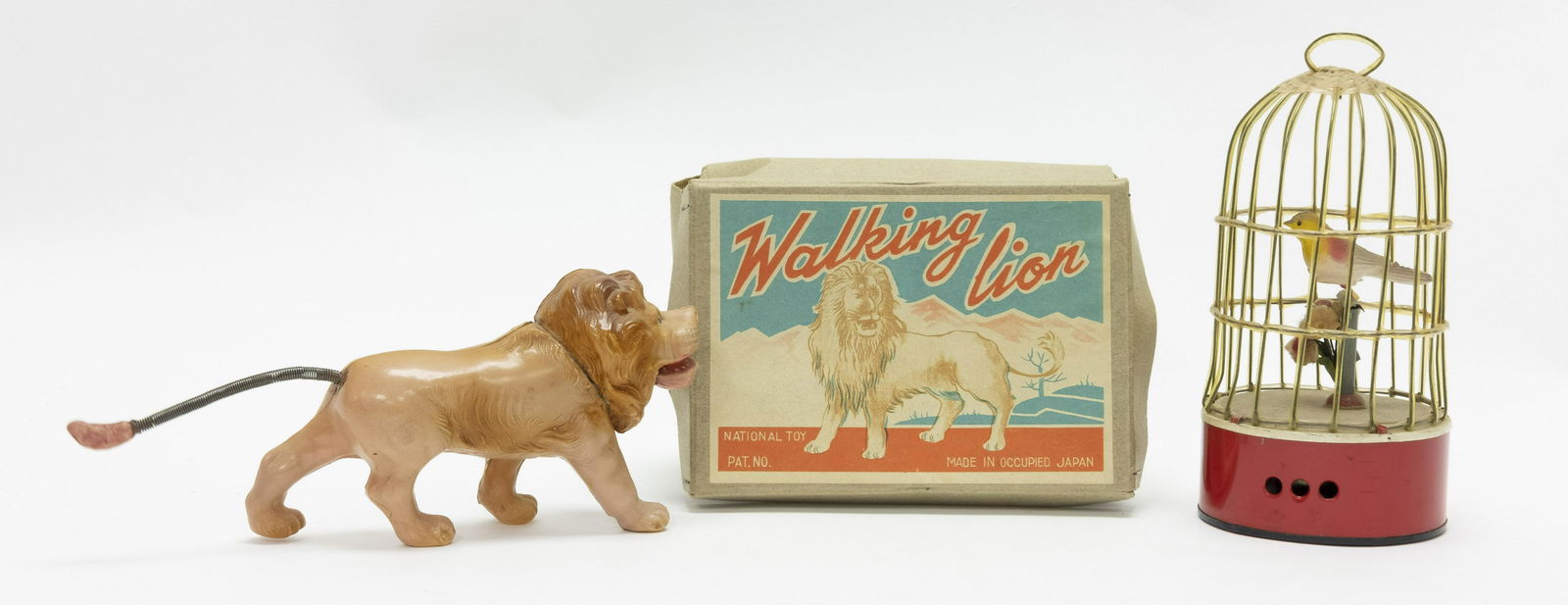 Windup Celluloid Walking Lion & Bird in Cage (1 of 2)