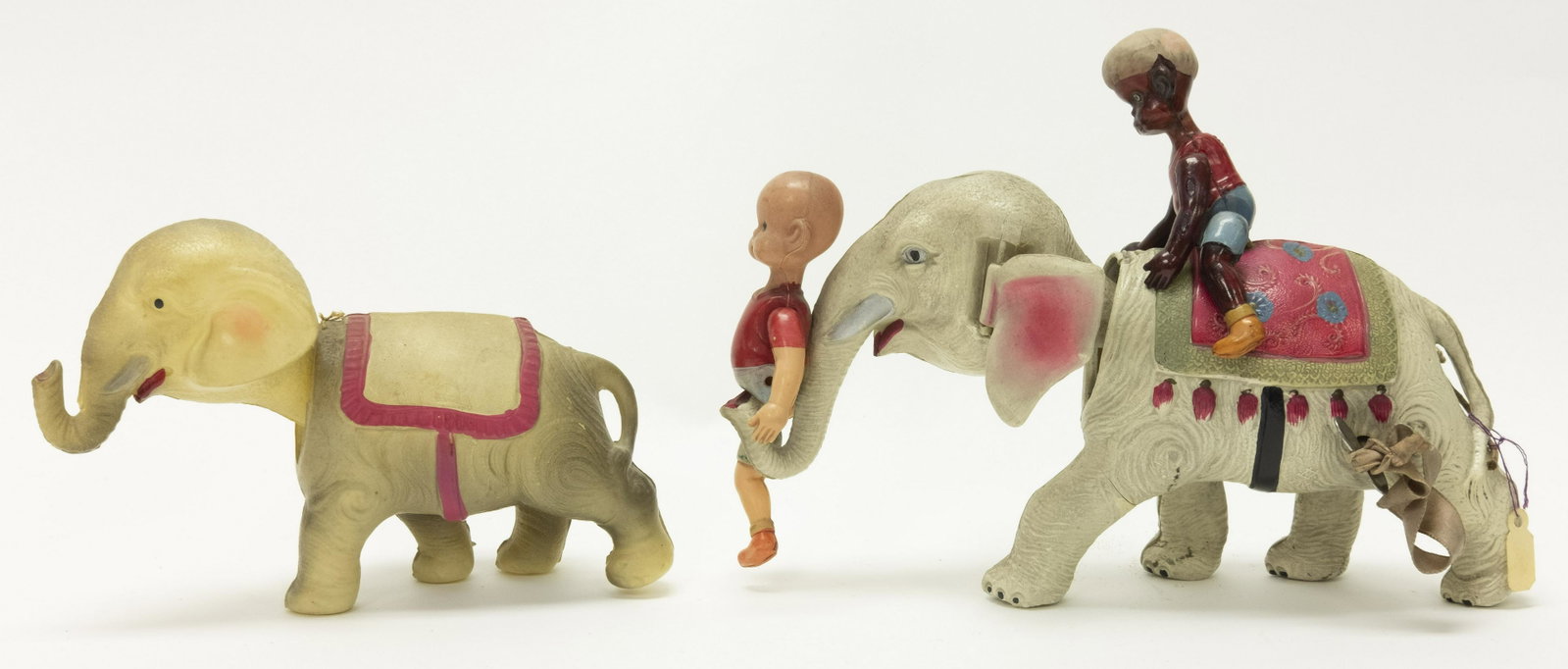 Two Celluloid Elephant Windup Toys: Made in Japan. Made of Celluloid. Both worked when tested. Very Fine to Excellent Condition. Henry is missing a leg.