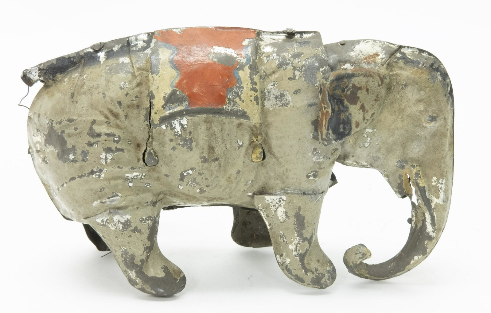 German Tin Hand Painted Windup Elephant: Made in Germany. Made of Tin. 6" L. Mechanism works, but the Elephant does not walk properly. Good Condition.