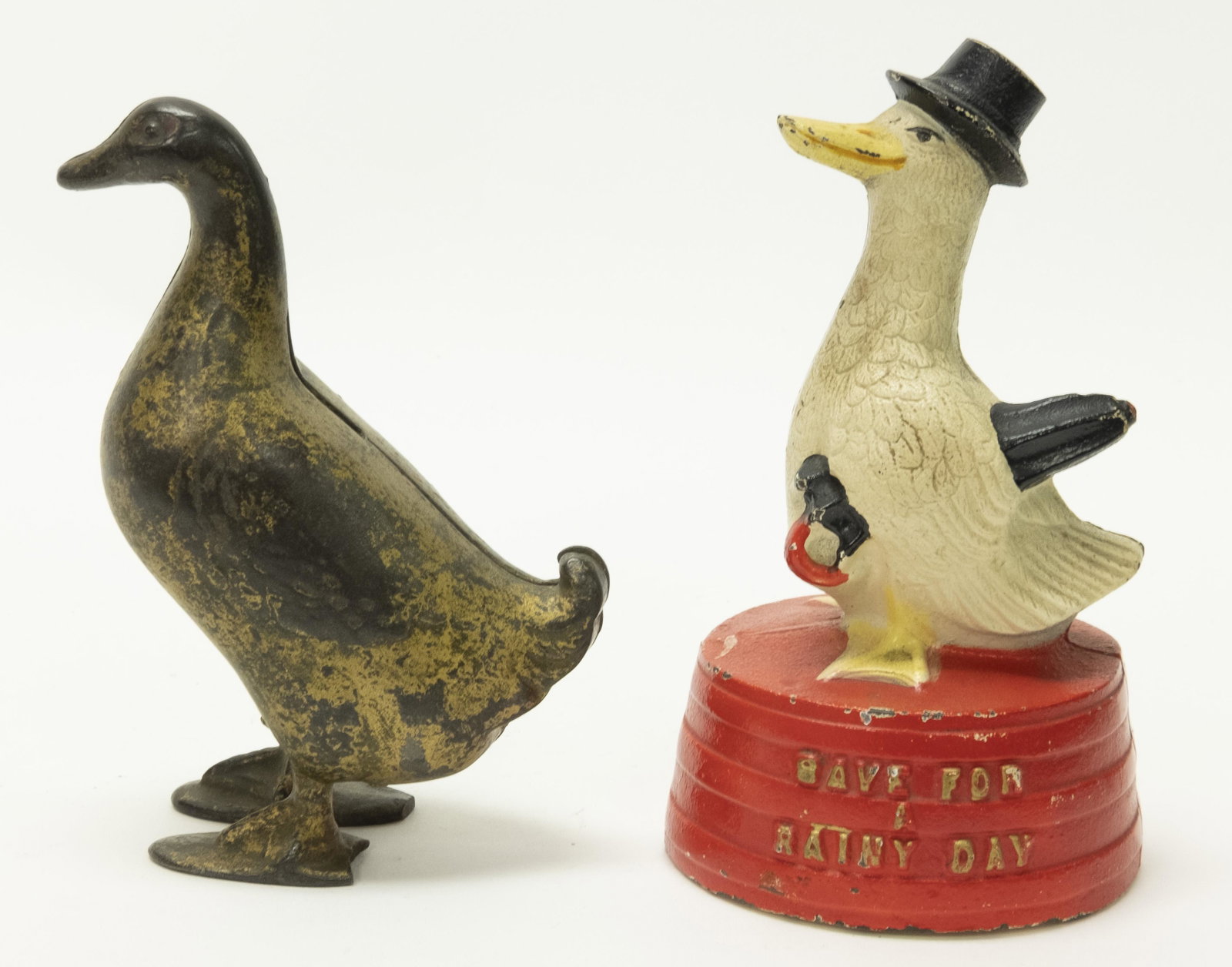 Save For a Rainy Day Duck & Duck Iron Banks: Included: Save for a Rainy Day Duck by Hubley circa 1930's and Duck by A. C. Williams circa 1910's. Made of Cast Iron. 4 7/8" - 5 1/2" T. Very Good to Very Fine Condition.