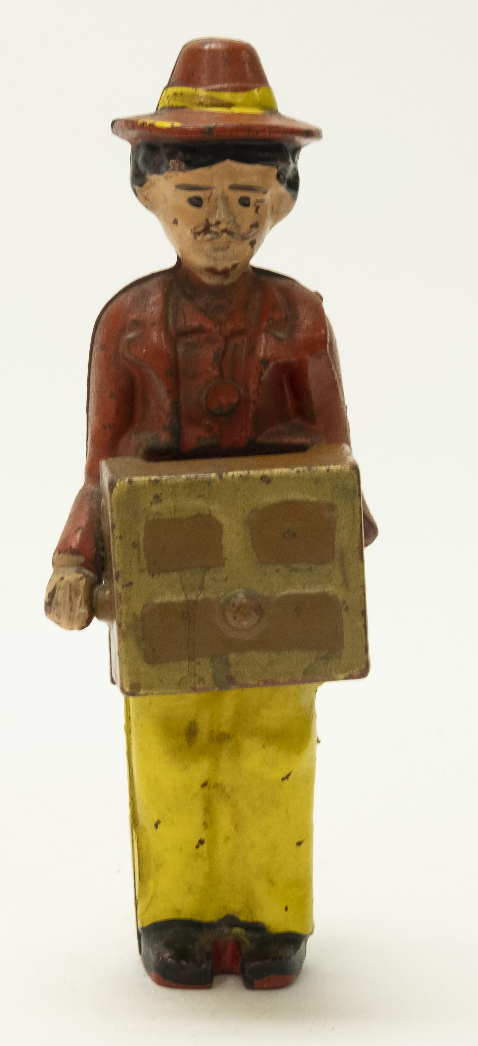 Organ Grinder Cast Iron Still Bank: Made by Hubley circa 1920's. Cast Iron. 6 1/4" T. Excellent Condition.
