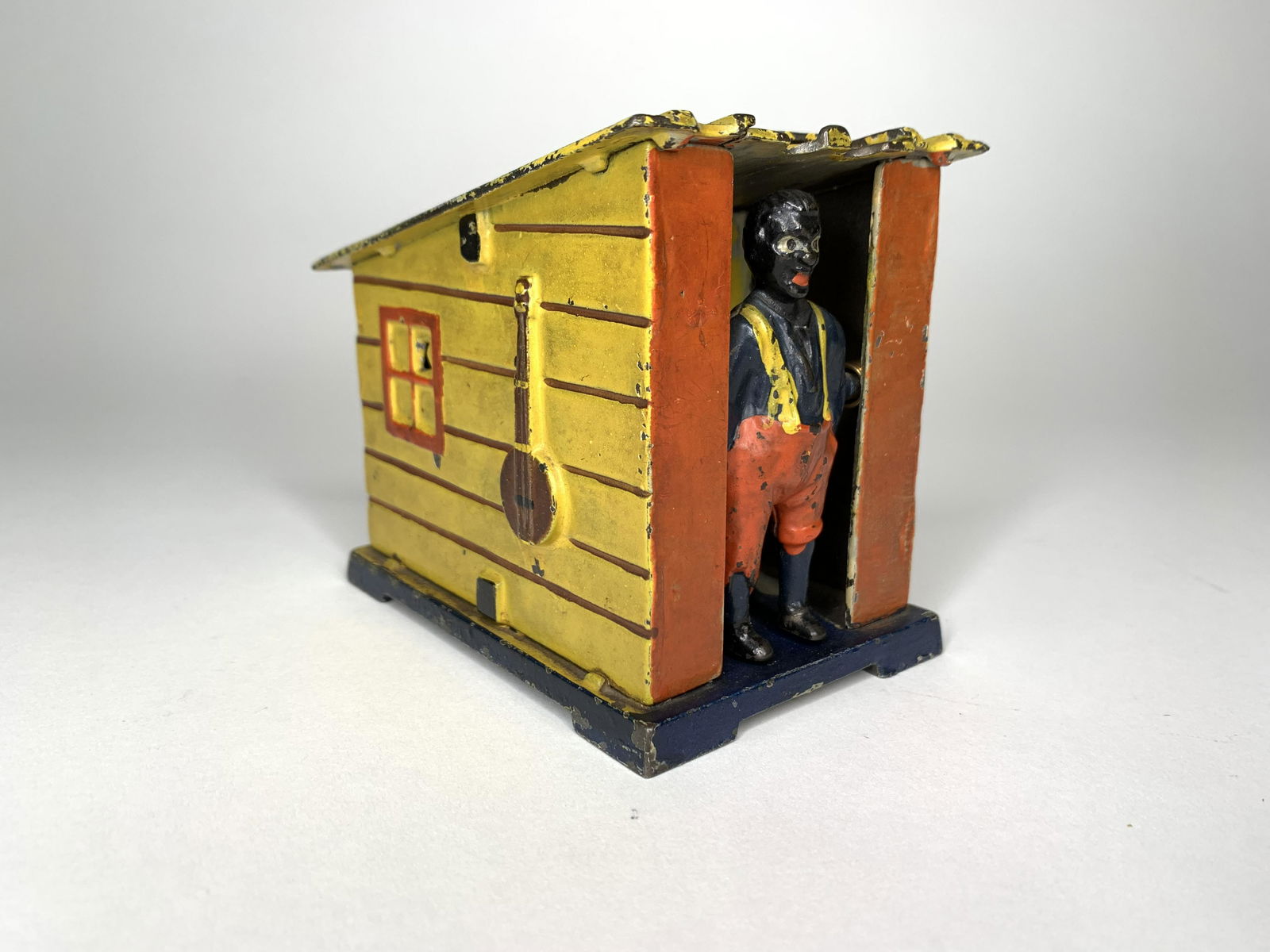 Yellow Cabin Mechanical Cast Iron Bank (1 of 4)