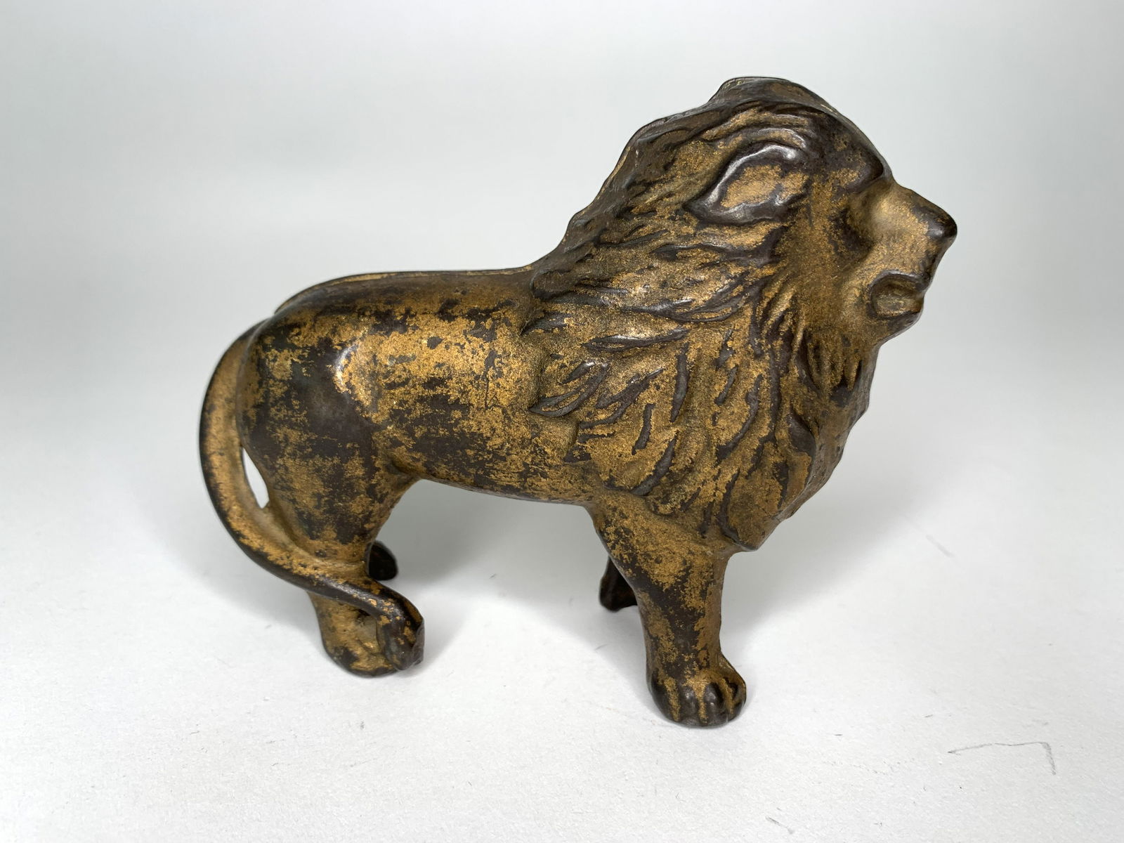 Lion Cast Iron Still Bank- Tail Right: Made by A.C. Williams Company. Circa 1900. Very Good Condition.