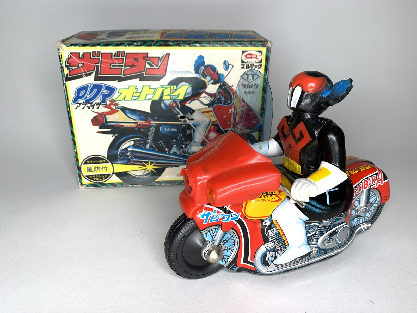 Bullmark Akumaizer Garibar Motorcycle: Made by Bullmark. Japan. Hard plastic and tin. No. 1000. Circa 1970. Measures 9 inches in length. Retains original cardboard inserts. With original box for Japanese market. Condition Figure Excellent.