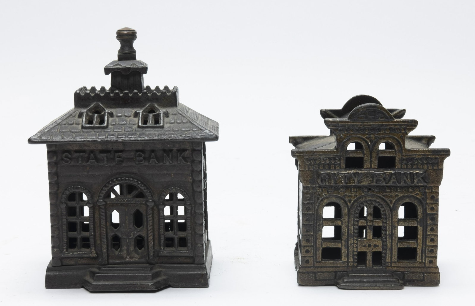 State and City Cast Iron Banks: Includes: State Bank (Kyser & Rex) and City Bank with Directors Room (John Harper Ltd.). Made of Cast Iron. Very Fine Condition. State Bank with replaced finial.