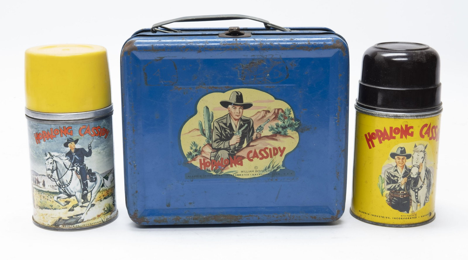 Hopalong Cassidy Lunch Box: Made by Aladdin Industries. Very Good Condition. Comes with Original Thermos and a Bonus Thermos. "As used" scratches, dent to one corner, latch with rust.